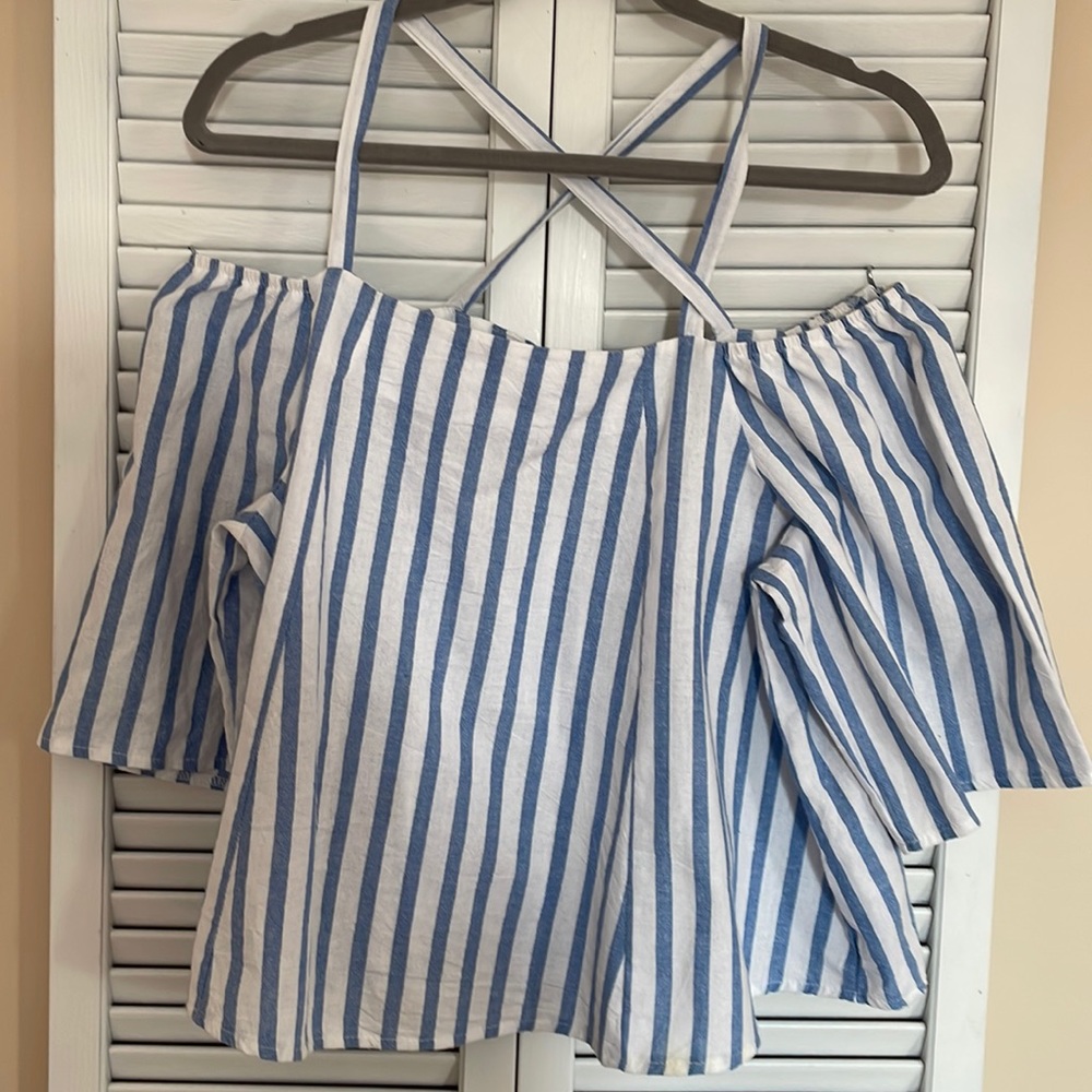 Woman’s off shoulder striped Tobi top